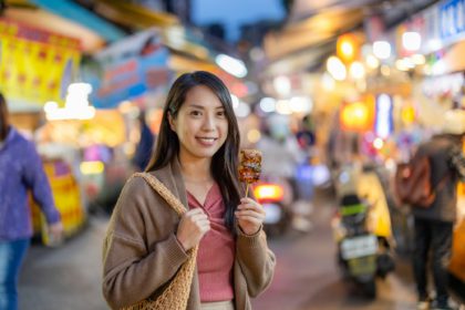 Woman go street market for local food in Taiwan